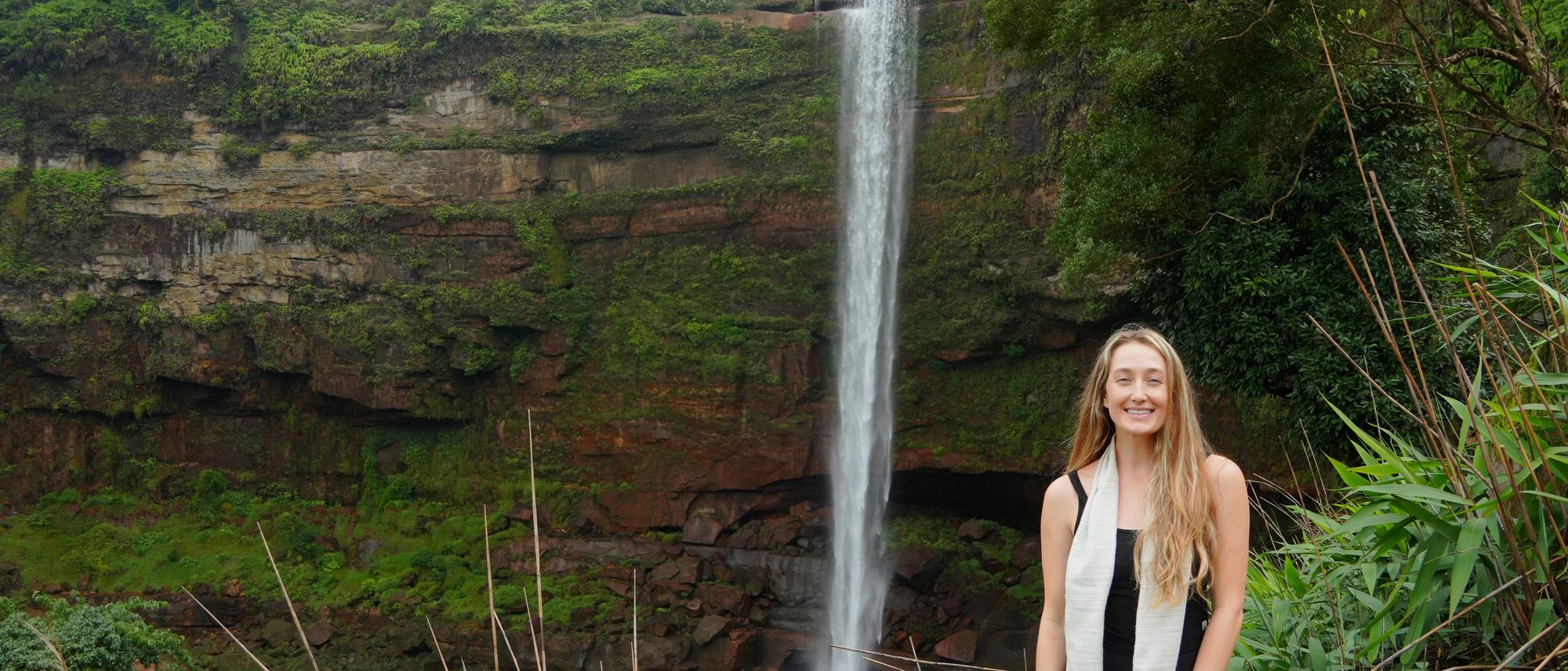 Kate Phelps on location at a waterfall